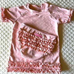 Ruffle Butts two-piece swimsuit. Size 7 children’s. Pink with white polka dots.